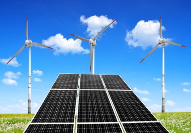 Güneş enerjisi panelleri ve rüzgar türbinleri.