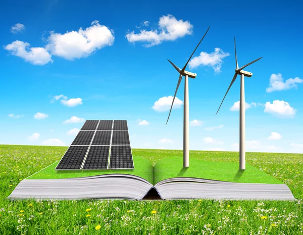 Libro ecologico con pannello solare e turbine eoliche su prato . — Foto Stock