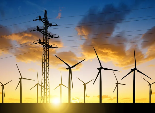 High voltage tower and wind turbines — Stock Photo, Image