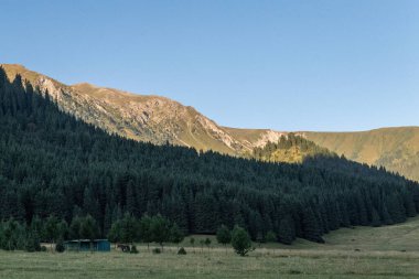 Impression of a sunrise over the mountains of Northern Kyrgyzstan.