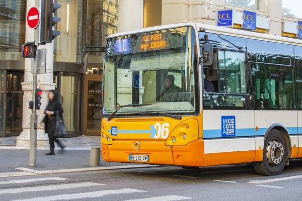 NICE, FRANCE, on JANUARY 7, 2016. City landscape, winter day. The bus has stopped near the traffic light