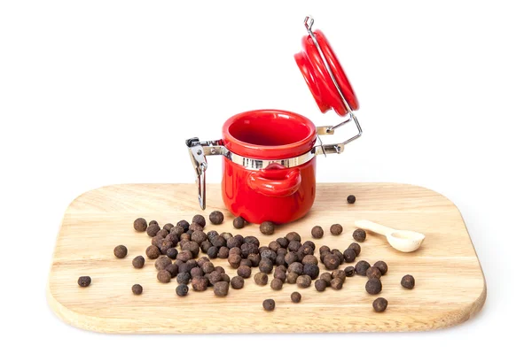 The red ceramic container for spices and black allspice — Stock Photo, Image