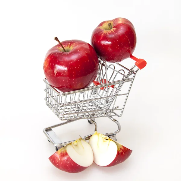 Red ripe apples in the cart for purchases — Stock Photo, Image