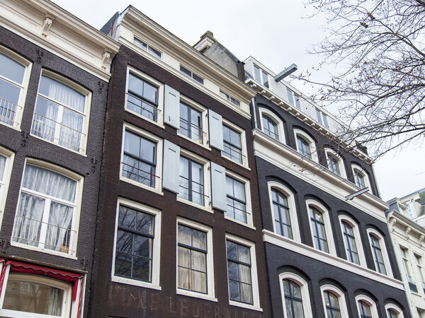 AMSTERDAM, NETHERLANDS on MARCH 27, 2016. Typical architectural details of houses XVII-XVIII of construction