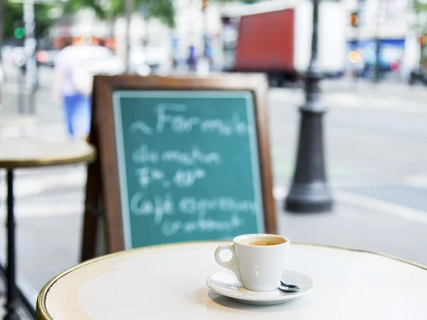 PARIS, FRANCE, on JULY 12, 2016. A small cup of coffee on a table of street cafe.