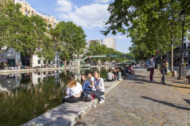 PARIS, FRANCE, on JULY 6, 2016. Saint Martin channel (fr. canal Saint-Martin). Embankments and their reflection in water clipart