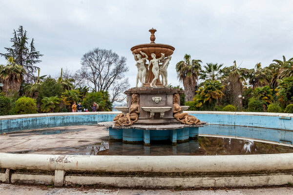 Sochi, Russia, April 13, 2021. Fountain "Dancing Bacchantes" near the main building of the abandoned Ordzhonikidze sanatorium, historical and cultural landmark