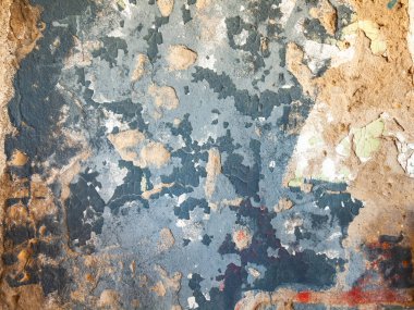 Alçılı eski bir taş duvarın yüzeyi