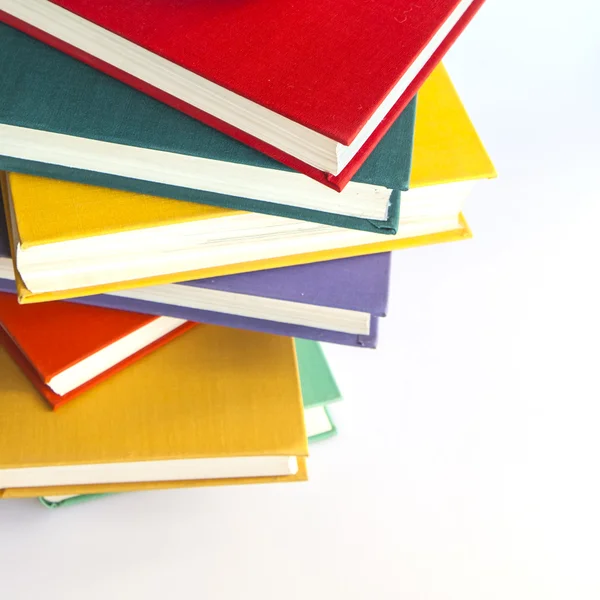 Montón de libros antiguos en fundas multicolores — Foto de Stock