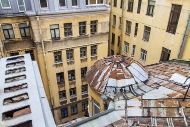 St. Petersburg, Russia, on November 2, 2014. An apartment view from the window to the typical old city yard well clipart