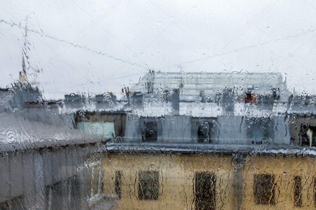 St. Petersburg, Russia, on November 3, 2014. An architectural fragment of the typical house constructed at the beginning of the XX century. A look through wet glass during a rain
