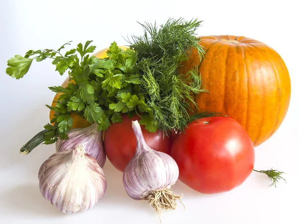 Orange pumpkin, tomato, greens and garlic for salad — Stock Photo, Image