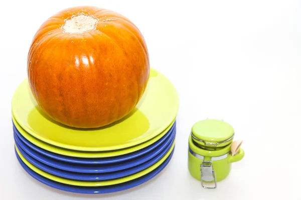 Orange pumpkin and ware for table layout — Stock Photo, Image