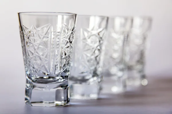 Ware for table layout. Crystal shot glasses — Stock Photo, Image