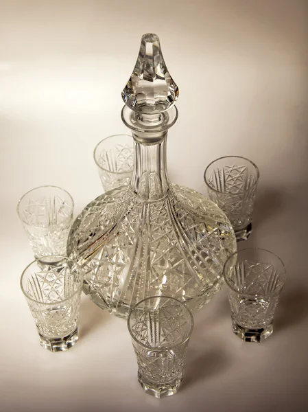 Ware for table layout. Crystal shot glasses and decanter — Stock Photo, Image