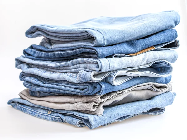 Pile of jeans of various shades — Stock Photo, Image