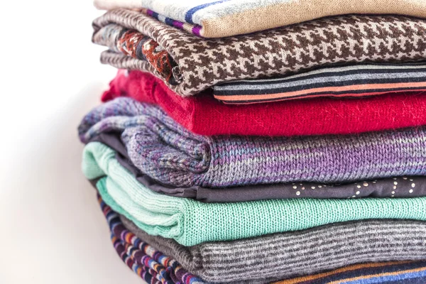 Different knitted a jumper, put by a pile — Stock Photo, Image