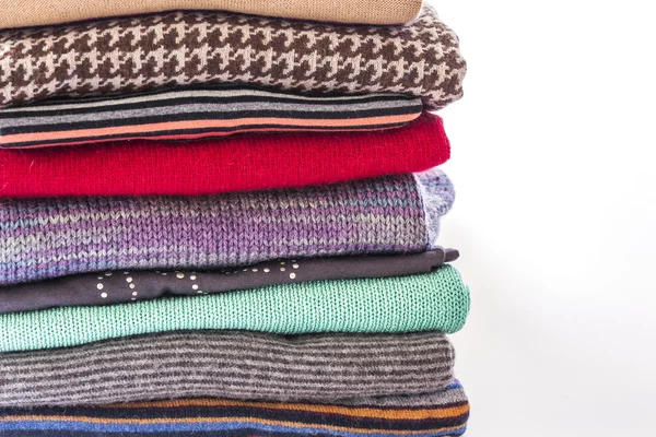 Different knitted a jumper, put by a pile — Stock Photo, Image