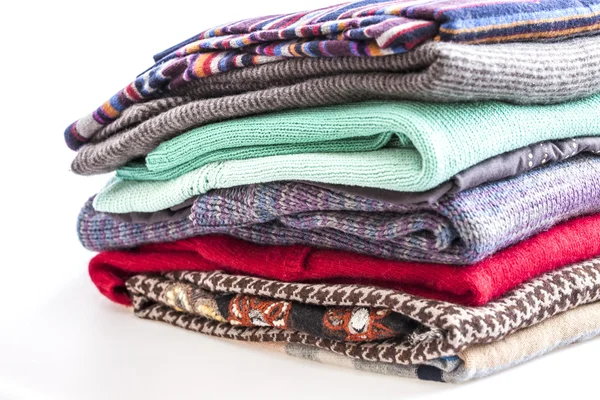 Different knitted a jumper, put by a pile — Stock Photo, Image