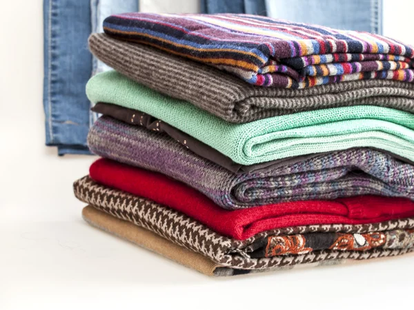 Pile of woolen jumpers of various colors and textures — Stock Photo, Image