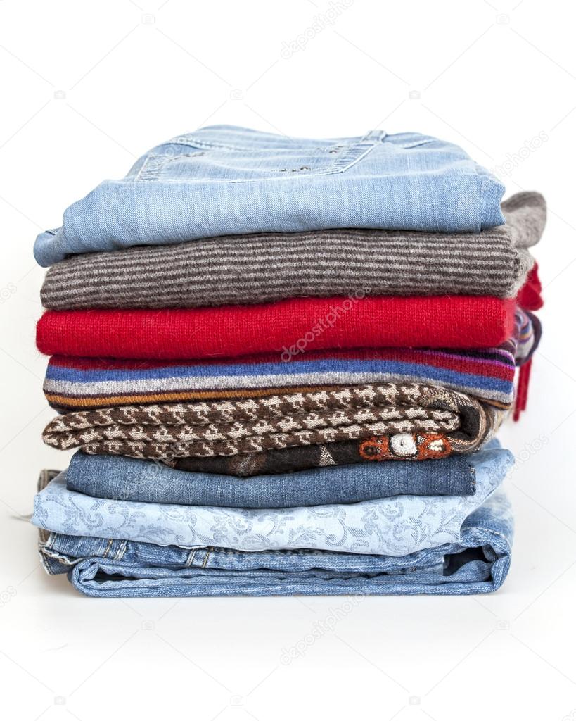 A woolen jumpers and jeans of various shades