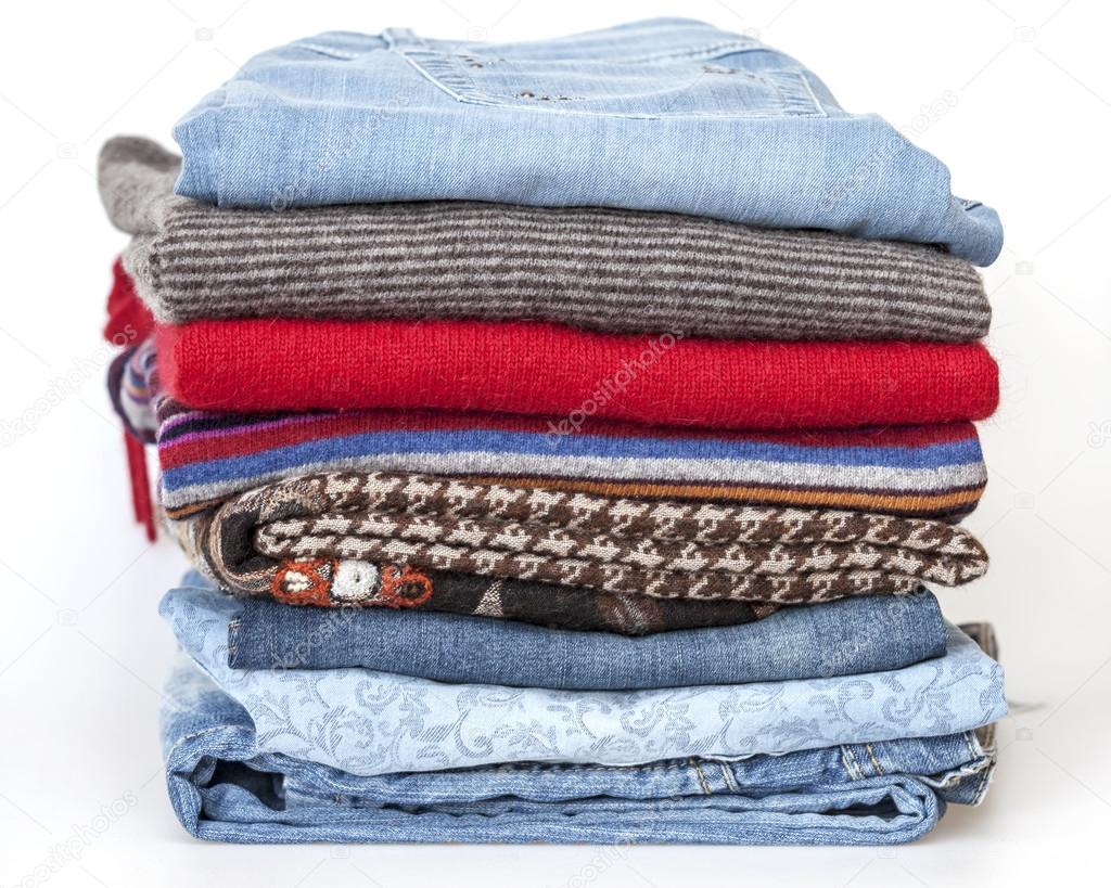 A woolen jumpers and jeans of various shades