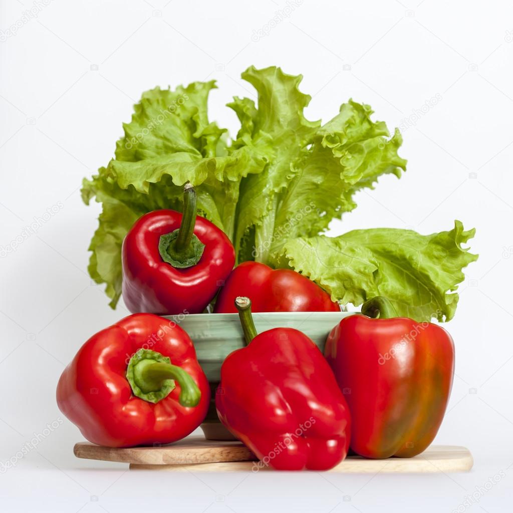 Large red paprika and bunch of fresh salad