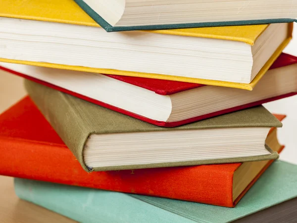 Vintage books in multi-colored covers on a table — Stock Photo, Image