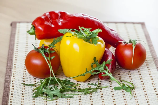 Red juicy tomatoes, leaves of arugula and sweet pepper — Stock Photo, Image