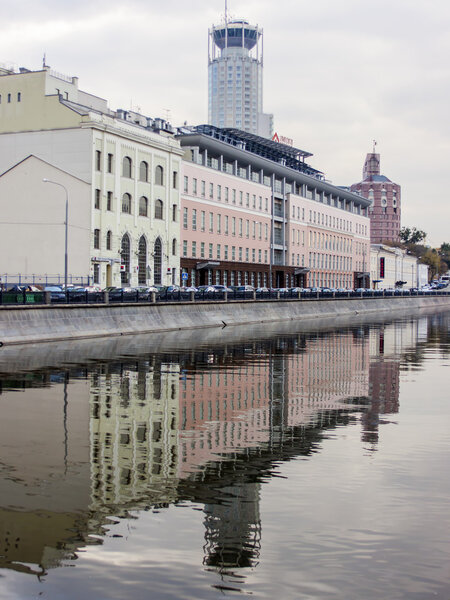 Moscow, Russia, on October 4, 2010. The river embankment Moscow and its reflection in water
