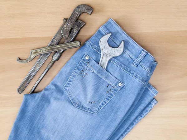 Blue jeans and vintage sanitary tools — Stock Photo, Image