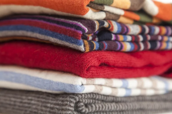 Pile of cashmere products on a counter of shop — Stock Photo, Image