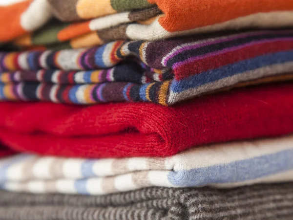 Pile of cashmere products on a counter of shop — Stock Photo, Image