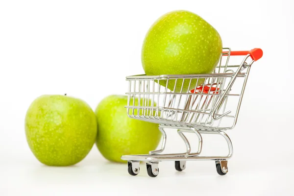 Large green apples in the cart for shopping — Stock Photo, Image