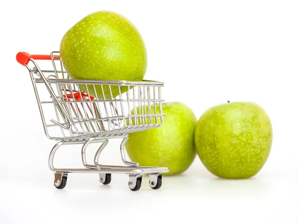 Large green apples in the cart for shopping — ストック写真