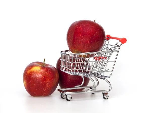 Large red apples in the store trolley — Stock Photo, Image