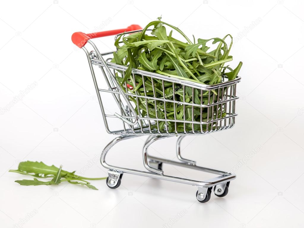 The store cart filled with arugula leaves