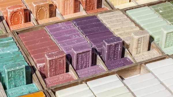 Nice, France, on March 10, 2015. Natural soap - a typical souvenir from Provence - lies on a counter of local shop — Stock Photo, Image