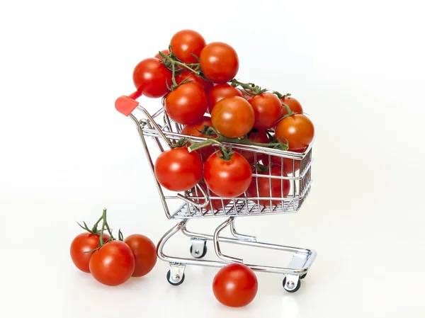 Cherry tomatoes in the store cart — Stock Photo, Image