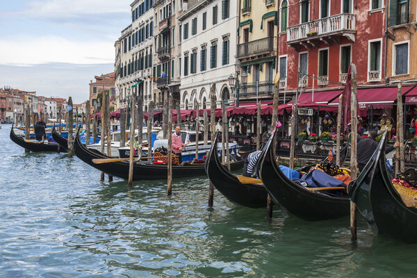 VENICE, ITALY - on APRIL 30, 2015. The gondola waits for passengers at the Grand channel (Canal Grande) embankment