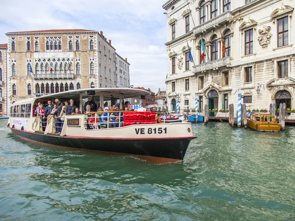 VENICE, ITALY - on APRIL 29, 2015. Vaporetto with passengers floats on the Grand channel (Canal Grande). Vaporetto - public transport in island part of Venice — Stock Photo, Image