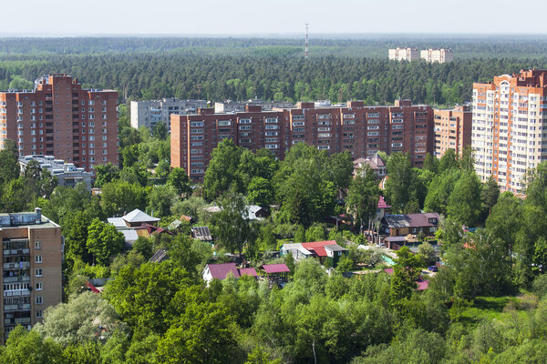 PUSHKINO, RUSSIA - on May 7, 2015. Новые многоэтажные дома на берегу реки Серебрянк
