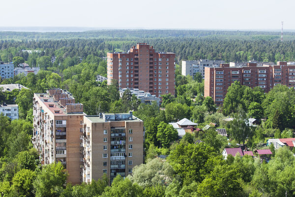 PUSHKINO, RUSSIA - on May 7, 2015. Новые многоэтажные дома на берегу реки Серебрянк
