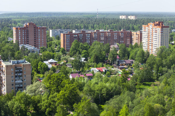 PUSHKINO, RUSSIA - on May 7, 2015. Новые многоэтажные дома на берегу реки Серебрянк
