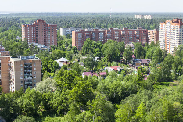 PUSHKINO, RUSSIA - on May 7, 2015. Новые многоэтажные дома на берегу реки Серебрянк

