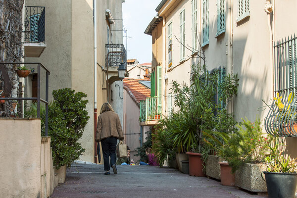 CANNES, FRANCE, on MARCH 12, 2015. The narrow curve street in the old city.