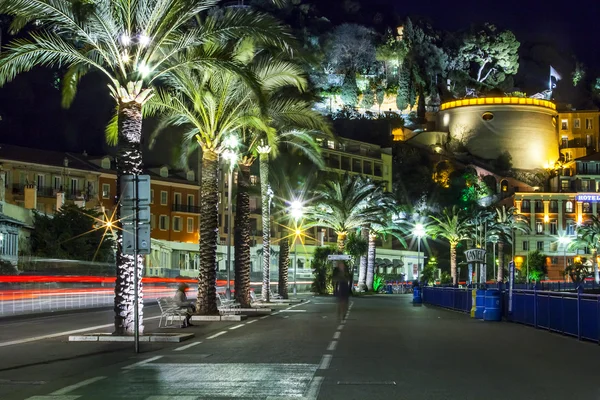 NICE, FRANCE, on MARCH 13, 2015. An English promenade (Promenade des Anglais) in evening. Belland's tower (Tour Bellanda). Promenade des Anglais - one of the most beautiful embankments in Europe