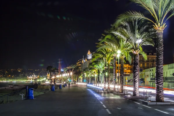 NICE, FRANCE, on MARCH 13, 2015. An English promenade (Promenade des Anglais) in evening lighting. Promenade des Anglais - one of the most beautiful embankments in Europe — Stock Photo, Image