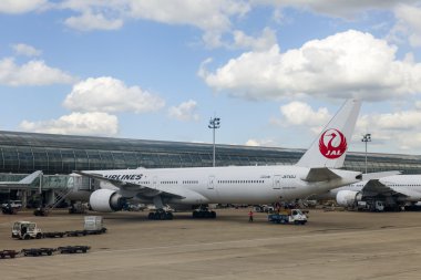 PARIS, FRANCE - on MAY 5, 2015. The international airport Charles de Gaulle, a view of the terminal E and the planes having preflight training from a window of the flying-up plane