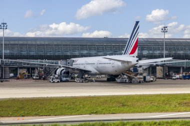PARIS, FRANCE - on MAY 5, 2015. The international airport Charles de Gaulle, service of the plane about the terminal E. A view from the window of the flying-up plane